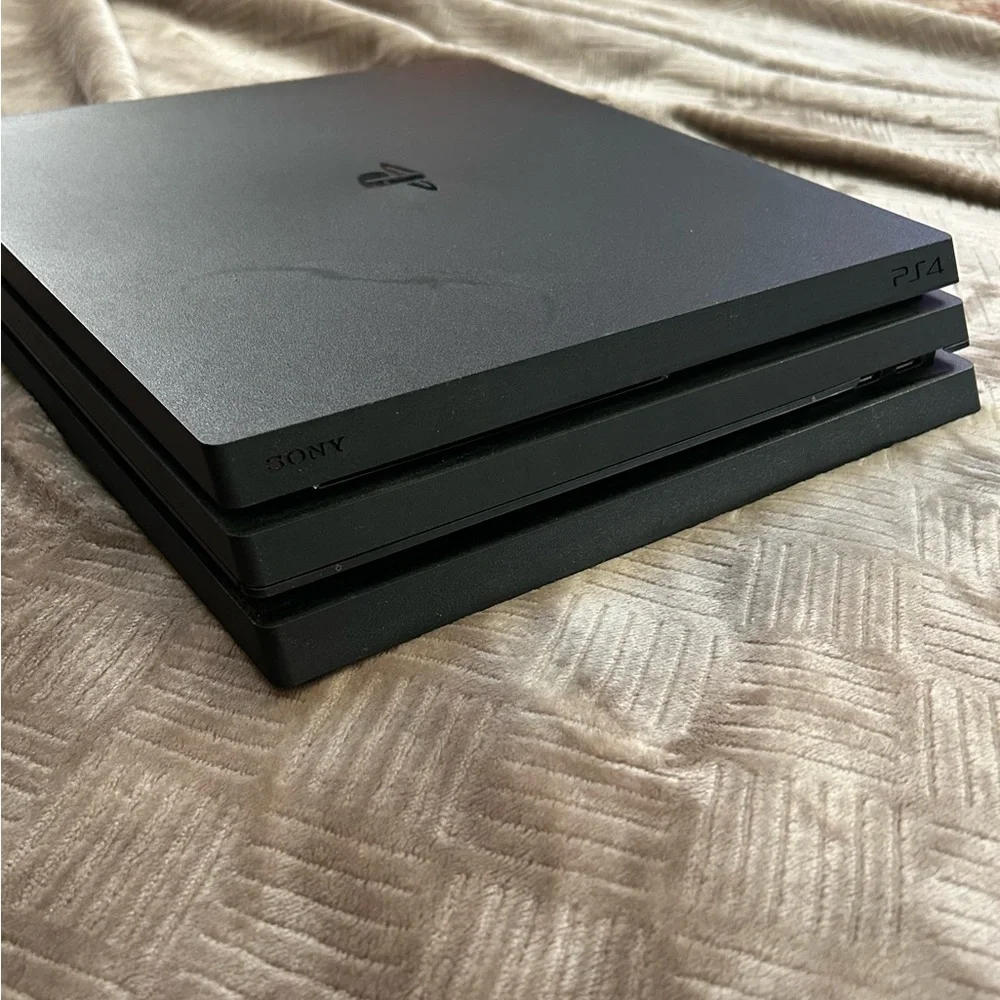 PS4 Pro + Controller + Power Cord + HDMI Cord + 2 Games